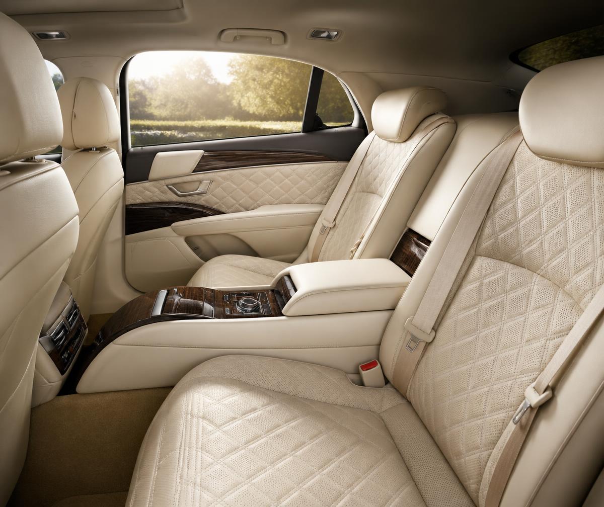 Cream leather rear cabin of an ultra-luxury sedan